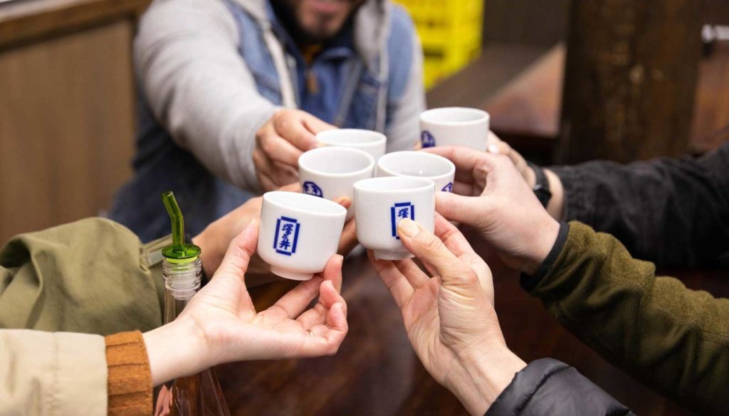 Sake tasting cheers on a tour